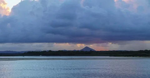 A beautiful dramatic cloudy sunset time-lapse on the Noosa River Mouth Video stock 85392484