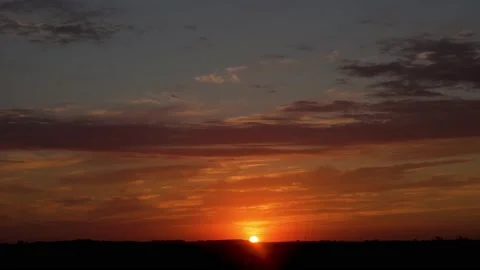 Beautiful Dramatic Fast Time Lapse of Dawn and Clouds in a Blue-Orange Sky. Sunr Stock Footage 147920323