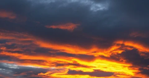 Beautiful dramatic nature clouds in red, orange, purple sunrise 4k UHD Stock Footage 107470812