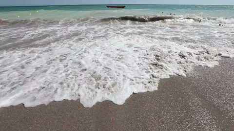 Beautiful dramatic ocean breaking waves washing beach sand wide shot Stock Footage 37711899