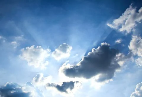 Beautiful dramatic sky with sun rays. Stock Photos