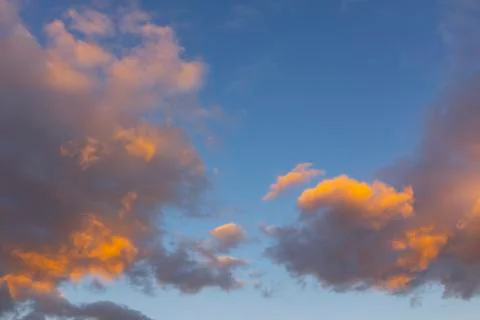 Beautiful dramatic sky. Sunset orange clouds. Orange golden sunset. Sunset rays  Stock Photos