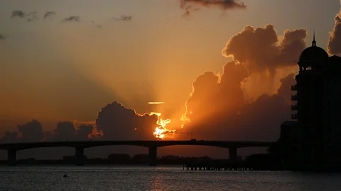 Beautiful dramatic sunset on the gulf behind bridge 스톡 동영상 115909959