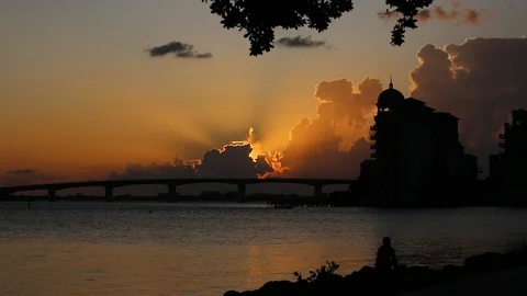 Beautiful dramatic sunset on the gulf behind bridge Stock Footage 115910015