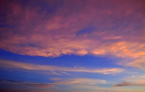 Beautiful dramatic sunset with  orange sky and awesome golden reflection. Stock Photos