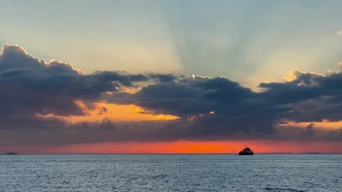 Beautiful dramatic sunset with the rain clouds over the sea Stock Footage 246490838