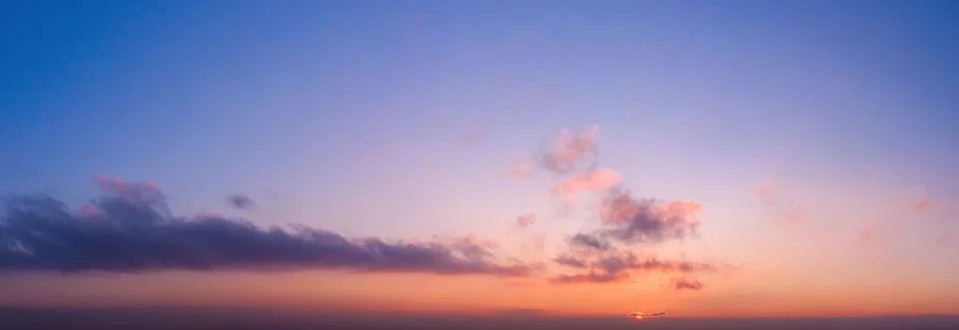 Beautiful dramatic sunset sky with clouds. Stock Photos