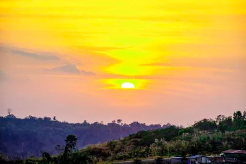 Beautiful dramatic sunset on the top of mountains. Landscape mountain with or Stock Photos