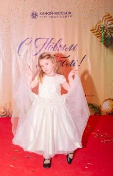 A beautiful dressed-up child performs at a children's beauty contest. Stock Photos