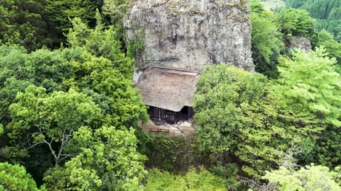 Beautiful Drone Flyover of a Remote Shinto Shrine Surrounded by Nature Stock Footage 336592389