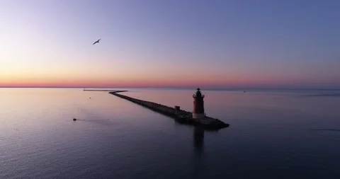Beautiful drone shot of a lighthouse in the Delaware Bay as a bird flys by Stock Footage 143206971