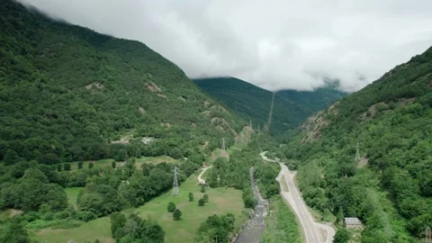 Beautiful drone view of an asphalt road in high mountains. Power line. Video stock 159797971