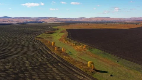 Beautiful drone view of plowed fields after harvesting n a sunny autumn day Stock Footage 275071586