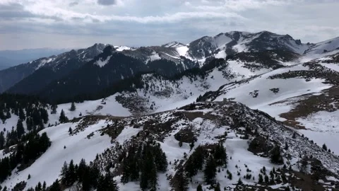 Beautiful drone view of Romanian mountains with Ice and Snow in Winter Spring Stock Footage 201062133