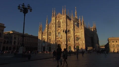 Beautiful Duomo Cathedral at sunset with orange sunlight in Milan, slow motion Stock Footage 117814830