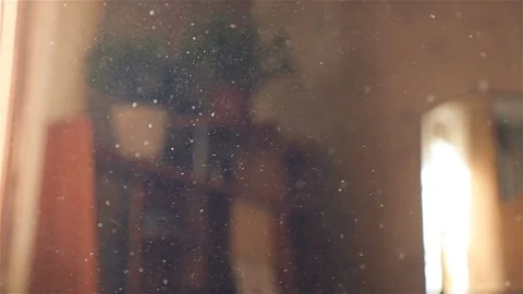 Beautiful dust in the room against the window. Light rays. Slow motion . Close Stock Footage 101484200