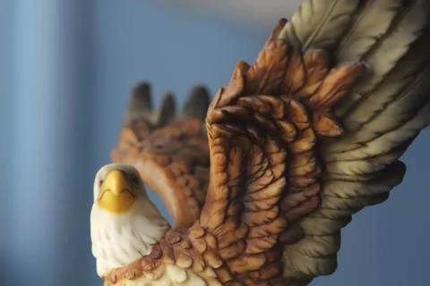 Beautiful eagle statue on a blue background. Stock-Fotos