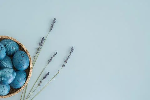 Beautiful easter background with painted easter eggs and lavender sprigs with Stock Photos