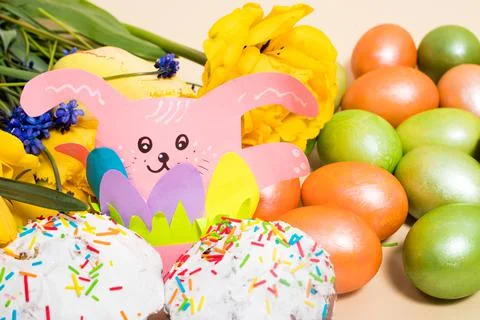 Beautiful Easter card with rabbit paper craft, eggs and cakes Stock Photos