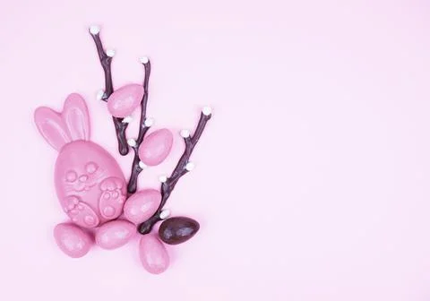Beautiful Easter composition with chocolate eggs, pussy willow and a hare on  Stock Photos