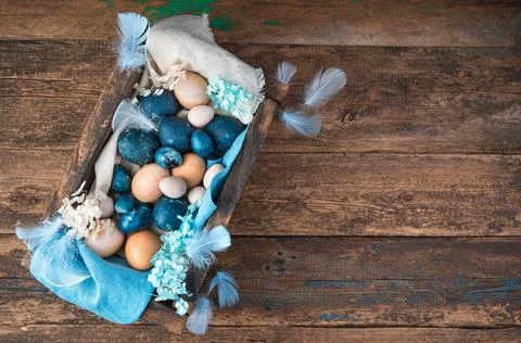 Beautiful Easter composition with painted and natural eggs on a wooden Stock Photos
