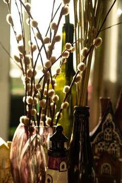 The beautiful easter composition of the willow branches, glass and ceramic. Stock Photos