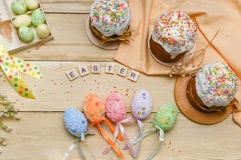 Beautiful Easter concept top view. Easter cakes with eggs. Stock Photos