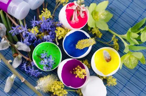 Beautiful Easter decoration with egg shells with paints and spring flowers Stock Photos
