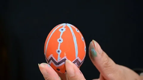Beautiful easter egg with orange and purple color pattern design Stock Footage 124543513