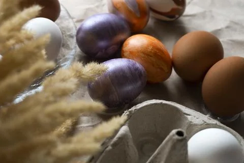 Beautiful Easter eggs lie on the table Stock Photos