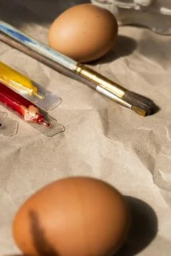 Beautiful Easter eggs lie on the table Stock Photos