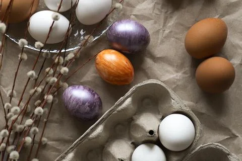 Beautiful Easter eggs lie on the table Stock Photos