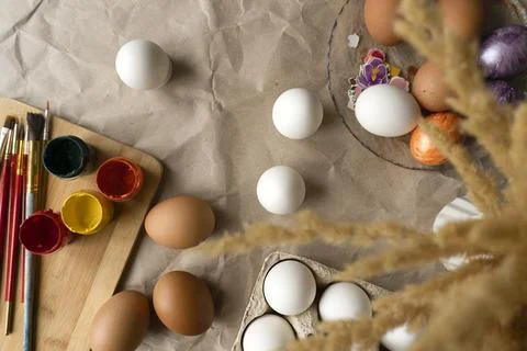 Beautiful Easter eggs lie on the table Stock Photos