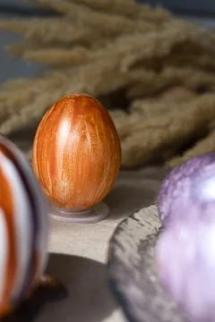 Beautiful Easter eggs lie on the table Stock Photos