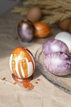 Beautiful Easter eggs lie on the table Stock Photos