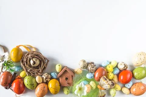 Beautiful Easter holiday background. Various easter eggs, nest, birdhouse, qu Stock Photos