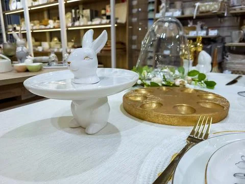 Beautiful Easter table decoration, egg stand and festive tableware. Bright Su Stock Photos