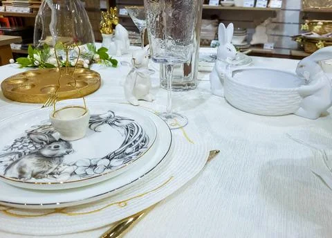 Beautiful Easter table decoration, egg stand and festive tableware. Bright Su Stock Photos