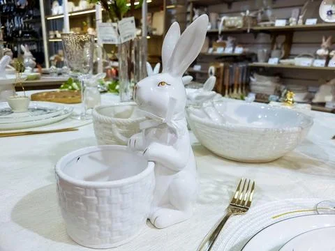 Beautiful Easter table decoration, egg stand and festive tableware. Bright .. Stock Photos