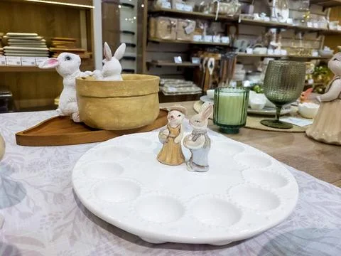 Beautiful Easter table decoration, egg stand and festive tableware. Bright .. Stock Photos