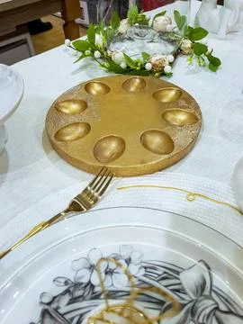 Beautiful Easter table decoration, egg stand and festive tableware. Bright Su Stock Photos