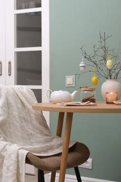 Beautiful Easter table setting with festive decor indoors. ceramic vase with Stock Photos