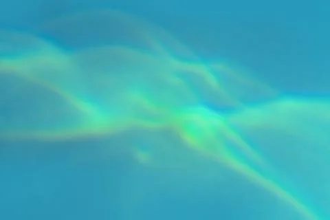 Beautiful effect of sun refraction on blue background. Caustics texture Stock Photos