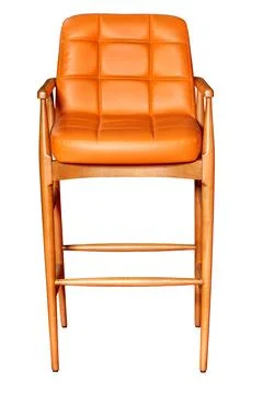 Beautiful elegant bar stool with soft brown leather seat. Stock Photos