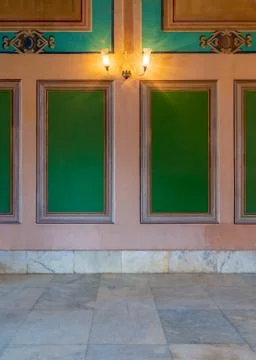 Beautiful elegant carved green frames on orange wall with ornate border and 库存照片