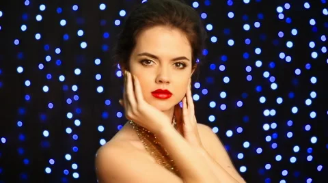 Beautiful elegant lady model with makeup in golden dress and jewelry Video stock 54621579