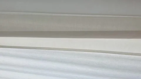 Beautiful elegant window curtains blowing in the wind. Close up on fabric blind Stock Footage 271234683