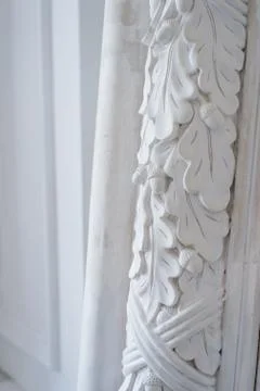 Beautiful elements of luxury wall design, white stucco mouldings over light Fotos Stock