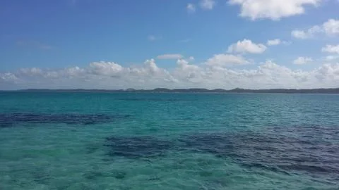 A beautiful emerald sea with shadows of corals Stock Photos