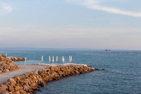 Beautiful empty evening seaside beach Stock Photos
